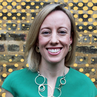 CEO Vicki Cardwell with comic background